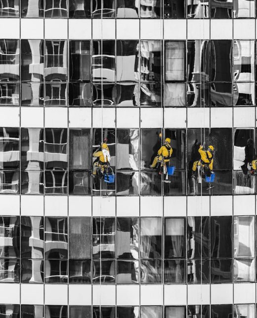 Five Person Cleaning Glass Building